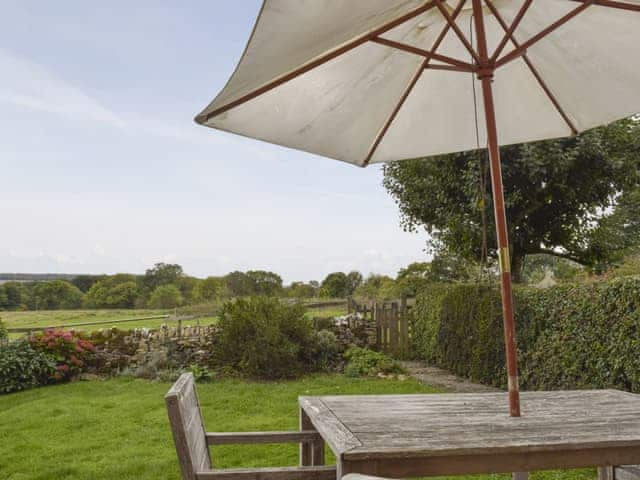 Outdoor furniture on the patio overlooks the enclosed garden | South View Cottage, Dean, near Chadlington