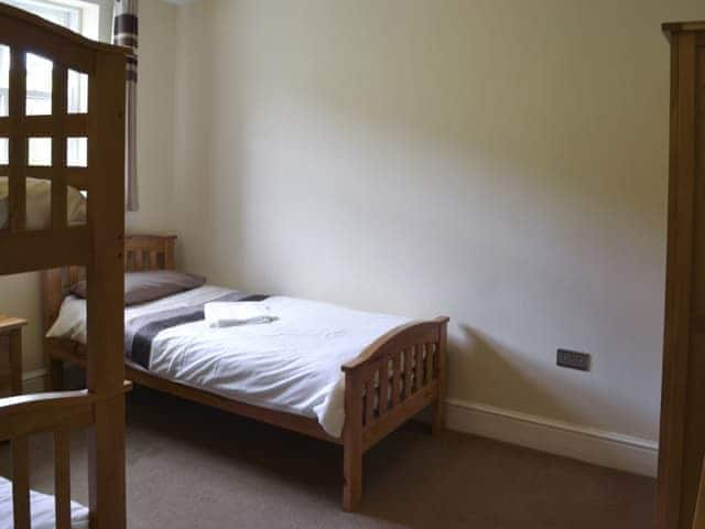 Tranquil bedroom with bunk beds and a single bed | Durham Cottage - Bowlees Holiday Cottages, Wolsingham, near Stanhope