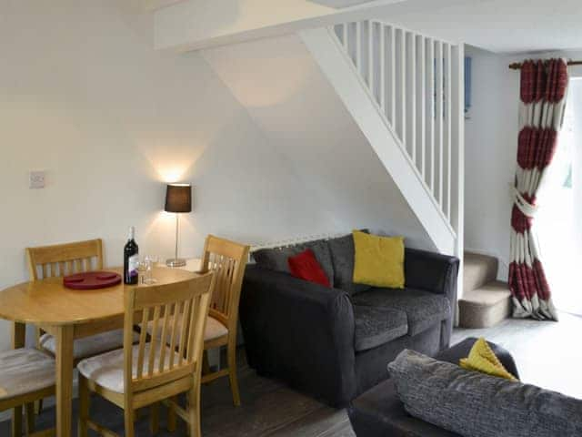 Relaxing lounge with dining area | Pottergate Cottage, Wroxham