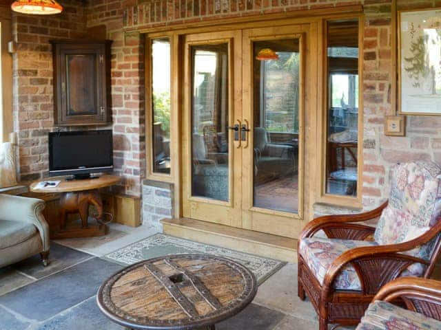 Light and airy sun room with flagstone floor | The Ashes, Low Dinsdale