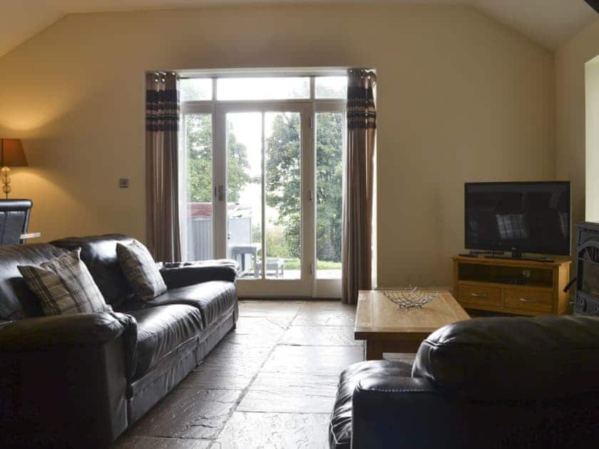 Comfortable lounge with wood burner and Freeview TV | Durham Cottage - Bowlees Holiday Cottages, Wolsingham, near Stanhope