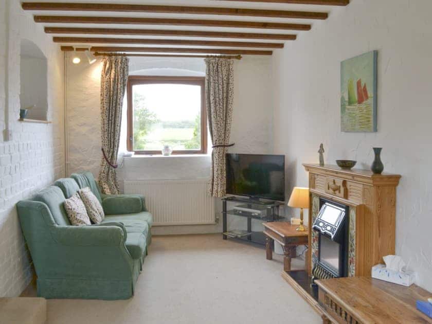 Welcoming living room | Foxhole - Kennacott Court Cottages, Widemouth, near Bude