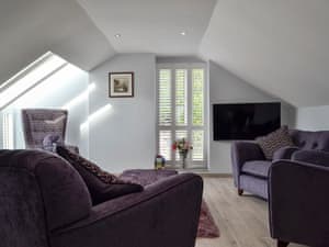 Cosy living room with wood floor | Ty Gambo, Plas Cilybebyll, near Pontardawe