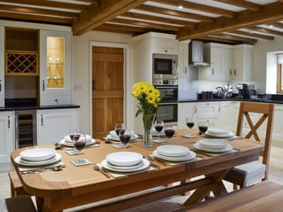 Open plan living space with vaulted ceiling and exposed beams | Hale Barn, Chiddingly, near Lewes