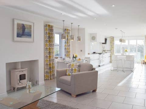 Chic contemporary living area with tiled floor | Ivy Bush Cottage, New Moat, near Narberth