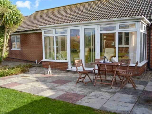 Large patio area | Rest-A-While, Walcott, near North Walsham