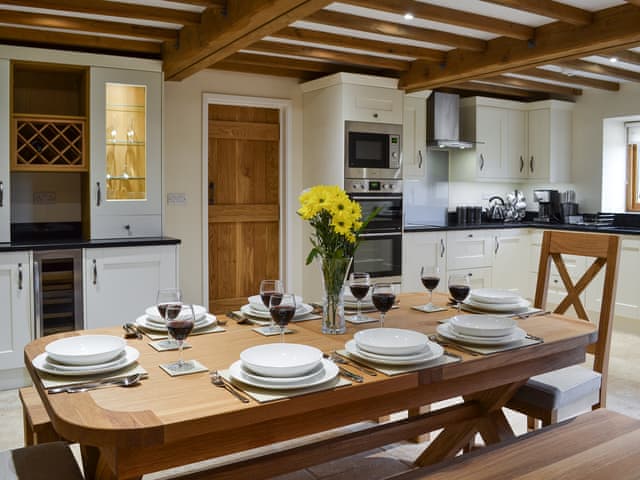Open plan living space with vaulted ceiling and exposed beams | Hale Barn, Chiddingly, near Lewes