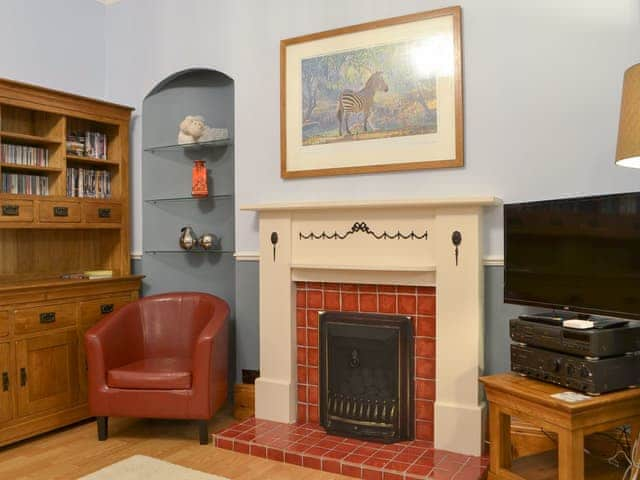 Traditional living room with elegant fireplace | Chartfield, Windermere