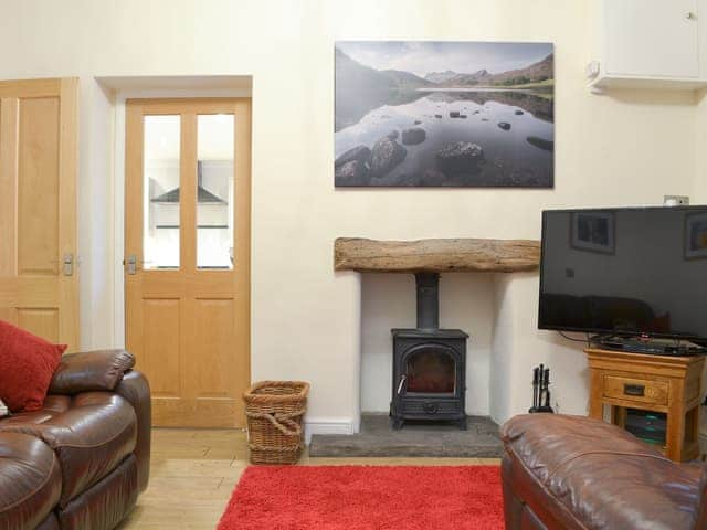 Warm and welcoming snug with wood burner | Chartfield, Windermere