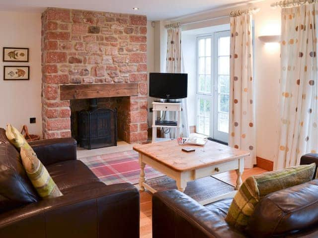 Lovely living room with French doors to the garden | Bramble Barn, Beal near Holy Island