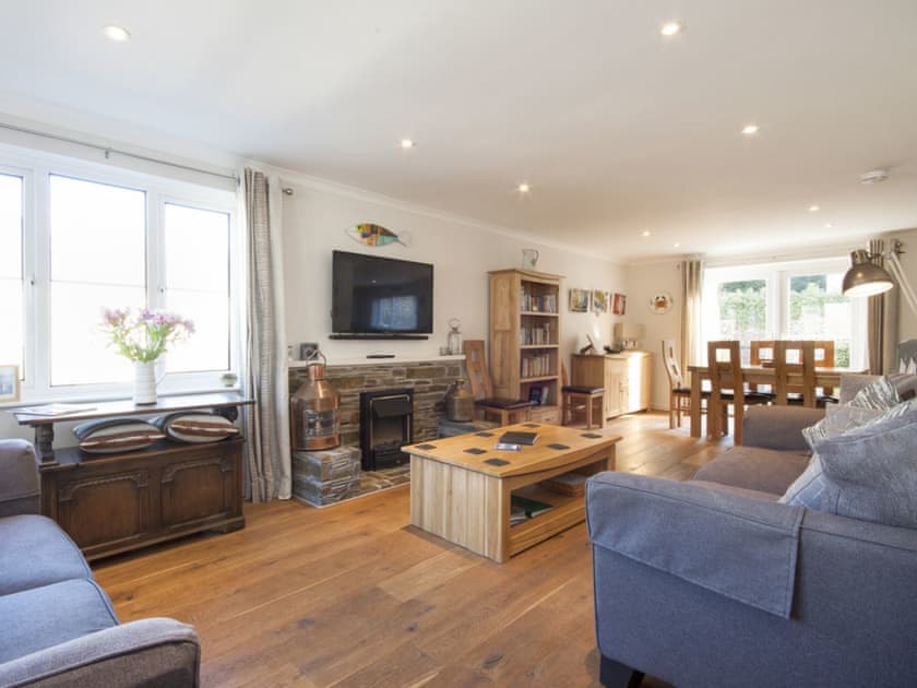 Open plan kitchen, dining and sitting room with french doors leading on to patio  | Eydon, Salcombe