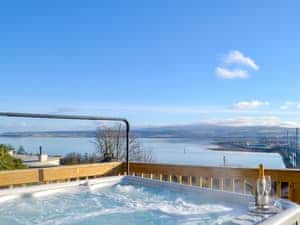 Relaxing hot tub with spectacular panoramic views over the waters of the inner Moray Firth | Balnacraig, Craigton, near Inverness