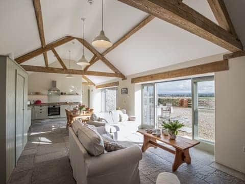 Open plan living space with wood beams | Long Barn - Bramleys Yard, Baltonsborough, near Glastonbury