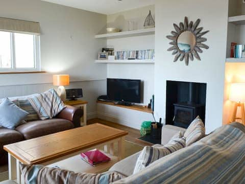 Relaxing living room with cosy wood burner | Gullsway, Beadnell