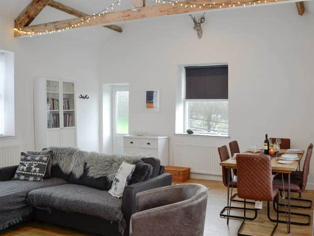 Well presented open plan living space with beams, vaulted ceiling and oak floor | Katellen Cottage, Threlkeld, near Keswick