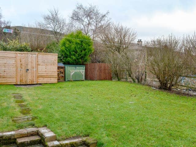 Enclosed garden with patio and garden furniture. Bike store | Katellen Cottage, Threlkeld, near Keswick