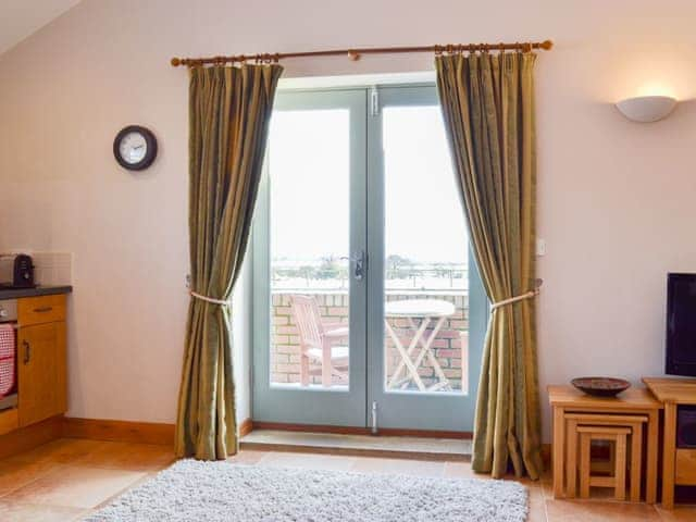 French doors in the living area giving access to the outdoors | The Wests - Grange Farm Cottages, Spaunton, near Lastingham