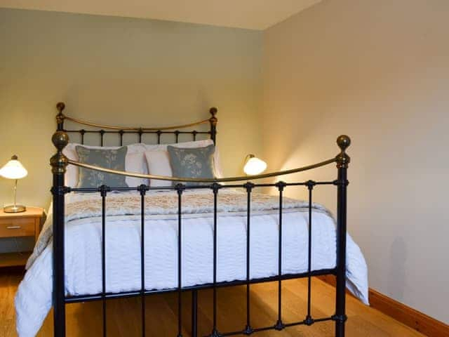 Romantic double bedroom with antique-style bed | The Wests - Grange Farm Cottages, Spaunton, near Lastingham