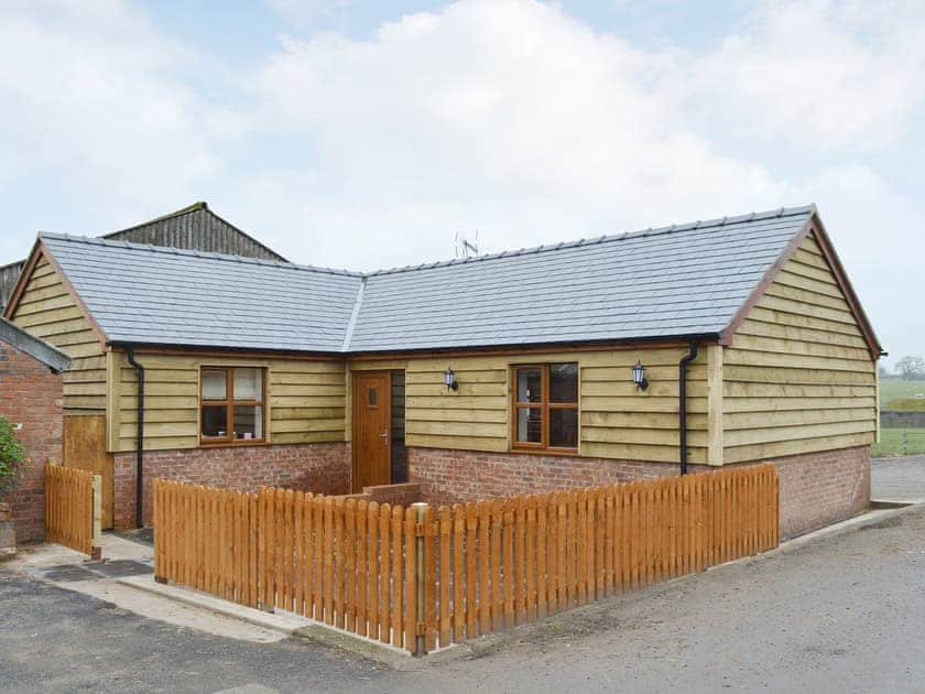 Attractive holiday home with enclosed patio area | The Corn Store - Millmoor Farm, Bickley, near Malpas