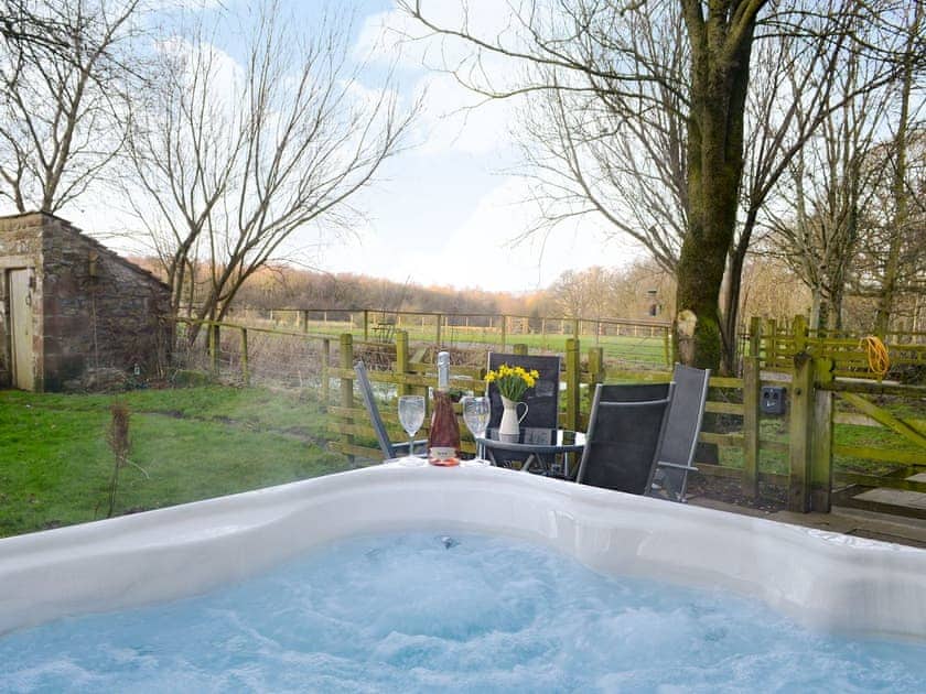 Relaxing private hot tub | Woodpecker Cottage - Wallace Lane Farm Cottages, Brocklebank, near Caldbeck and Uldale