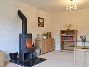 Living room with multi-fuel burner | Riverside, Kimelford, near Oban