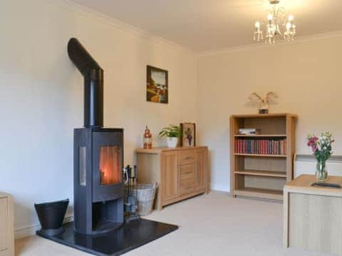 Living room with multi-fuel burner | Riverside, Kimelford, near Oban