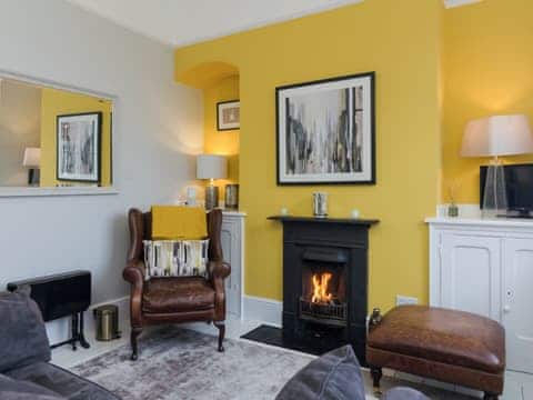 Cosy living room with open fire | Coastguard Retreat, Ramsgate