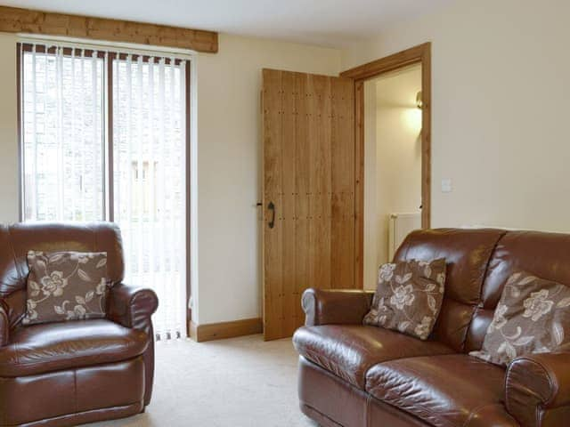 Comfy seating within the living room | Little Meadow - West House Farm, Dearham, near Maryport