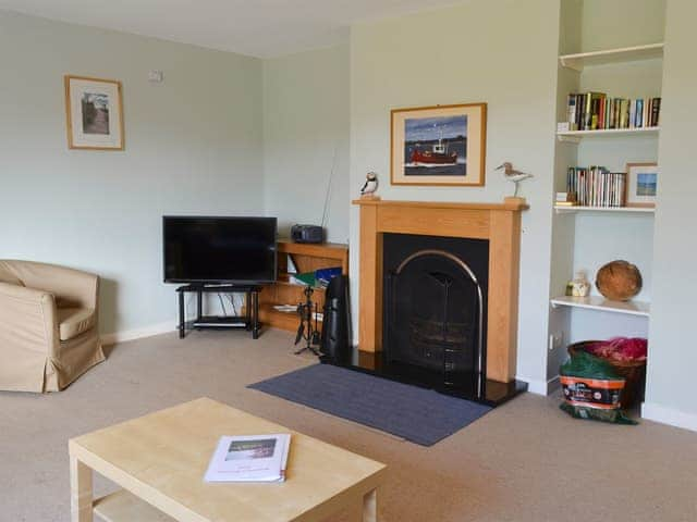 Cosy living room with open fire | Bickertons Field, Newton by the Sea