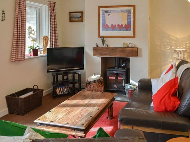 Charming living/dining room with open fireplace | Fairways, Beadnell, near Seahouses