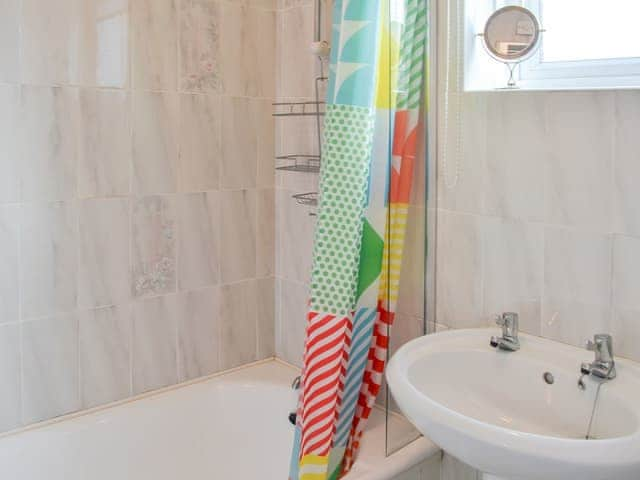 Bathroom with shower over the bath | Fairways, Beadnell, near Seahouses