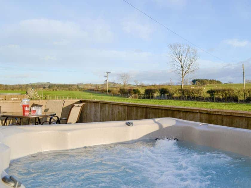 Luxurious hot tub and patio area | Little Meadow - West House Farm, Dearham, near Maryport