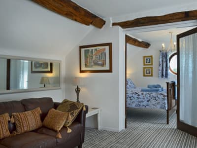 Cosy living/dining room with beams | The Beehive, Betley, near Nantwich