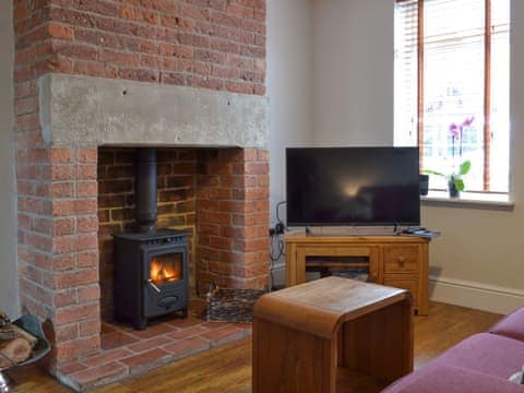 Cosy living room with wood burner | Jubilee Cottage, Clifton, near Ashbourne