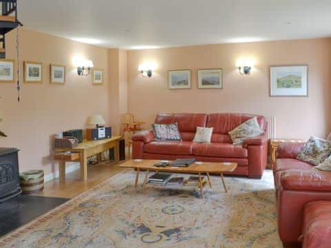 Delightful open plan living space with spiral staircase | Cherry Tree Cottage, Bovey Tracey