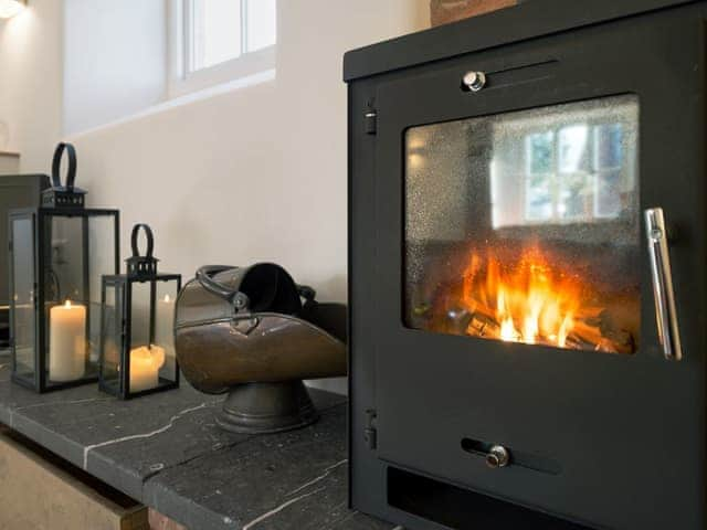 Toasty wood burner in living room | The Mill House, Aisholt, near Bridgwater