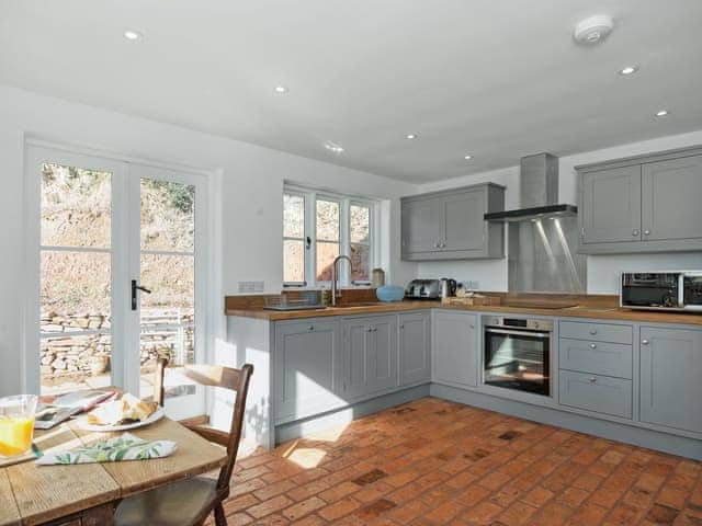 Spacious kitchen/dining room with French doors leading to garden | The Mill House, Aisholt, near Bridgwater