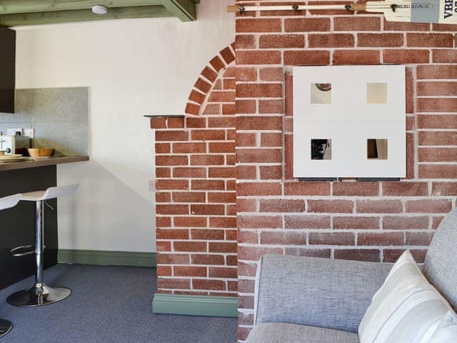 Lovely interior with exposed brickwork | Lucy&rsquo;s Lodge - Doddick Farm Cottages, Threlkeld, near Keswick