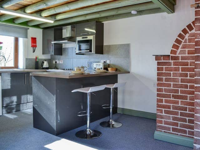 Well-appointed kitchen area with breakfast bar/Dining area | Lucy&rsquo;s Lodge - Doddick Farm Cottages, Threlkeld, near Keswick