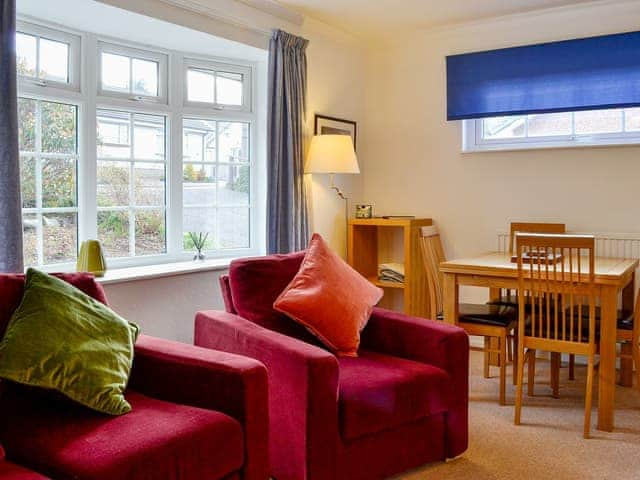 Living area with modest dining table and chairs | Haystacks, Keswick