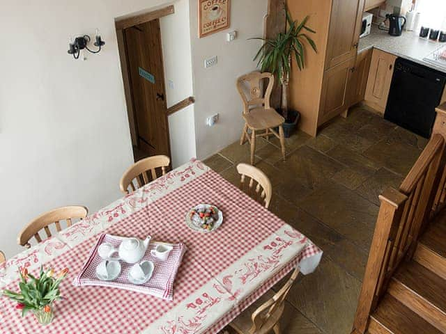 Dining area and kitchen viewed from the stairs | Old Corn Mill - Old Hall Farm Cottages, Walpole, near Halesworth