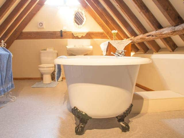 Charming bathroom with free-standing roll top bath | Old Corn Mill - Old Hall Farm Cottages, Walpole, near Halesworth