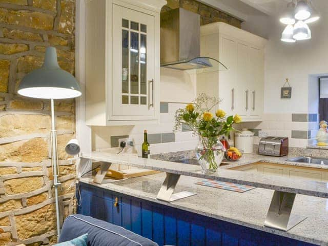 Adjoining kitchen can be seen from the living room | Clutter Cottage, Druridge Bay