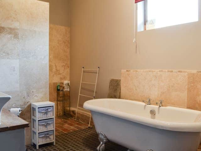 Bathroom with round-top bath | Meadow Barn - Brook and Meadow Barns, Shobley, Ringwood