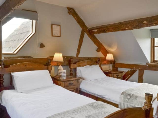 Characterful twin bedroom | Stocks Tree Cottage, Preston Wynne