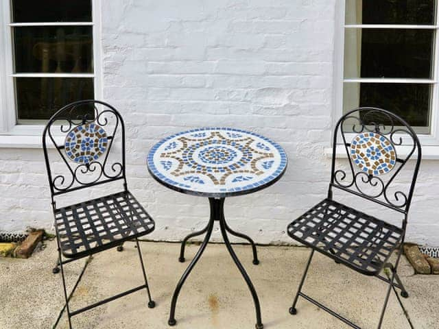 Patio area with outdoor furniture | Jenny&rsquo;s Cottage, Mundesley