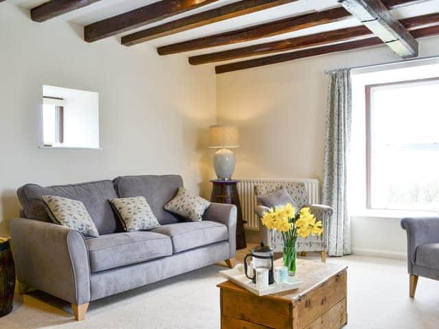 Comfy seating within living room | The Old Granary, Holy Island, near Berwick-upon-Tweed