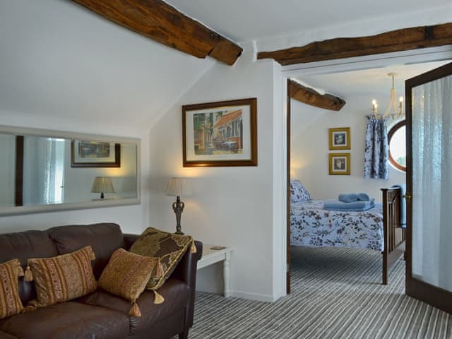 Cosy living/dining room with beams | The Beehive, Betley, near Nantwich