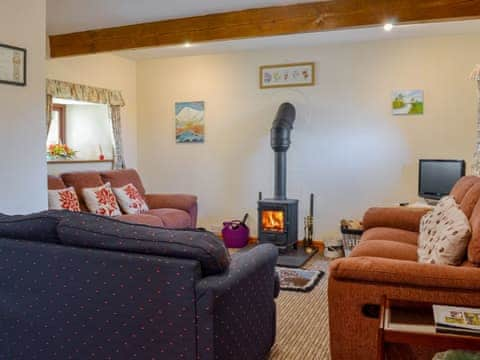 Delightful living room with cosy wood burner | Stonefold Cottage, Waberthwaite, near Ravenglass