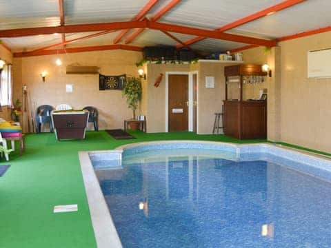 Private indoor swimming pool with games area and bar | Curlew Cottage, Near Bellingham